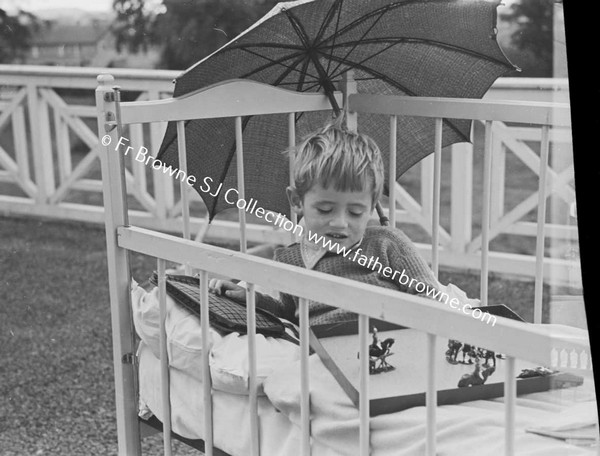 LOURDES HOSPITAL CHILD WITH PARASOL  PADDY GARVEY  20 ST MARYS TERRACE